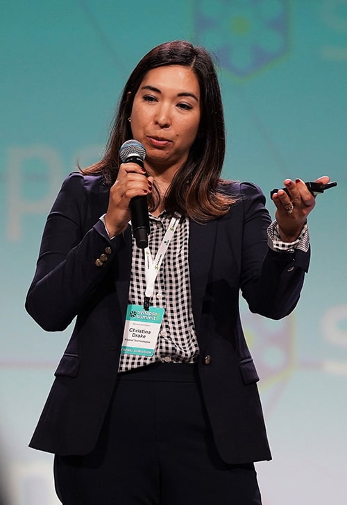 Women presenting with microphone in hand